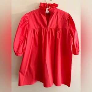 Beautiful trendy salmon colored blouse with a stand up ruffle collar